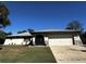 Ranch style home with attached garage and well-maintained lawn at 11253 Leland St, Spring Hill, FL 34609