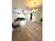 Spacious living room featuring gray vinyl flooring and lots of natural light at 11253 Leland St, Spring Hill, FL 34609