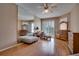 Main bedroom with wood floors, large mirror, and ample dresser space at 12922 Prestwick Dr, Riverview, FL 33579