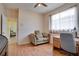 Bedroom with couch, home office space, and wood flooring at 12922 Prestwick Dr, Riverview, FL 33579