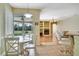 Kitchen nook with pool view, white table and chairs at 12922 Prestwick Dr, Riverview, FL 33579