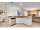 Kitchen with granite countertops and island with sink and dishwasher at 12922 Prestwick Dr, Riverview, FL 33579