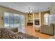 Bright living room features a fireplace, pool view, and hardwood floors at 12922 Prestwick Dr, Riverview, FL 33579