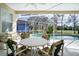 Screened pool area with patio furniture and view of the backyard at 12922 Prestwick Dr, Riverview, FL 33579