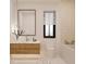 Elegant bathroom with a floating vanity, bathtub, and stylish tile at 13750 Park Blvd # 1, Seminole, FL 33776