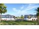 Side view of townhomes showcasing landscaping and a residential street at 13750 Park Blvd # 2, Seminole, FL 33776