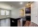 Modern kitchen island with granite countertop and stainless steel dishwasher at 13913 Sage Thrasher Ln, Riverview, FL 33579