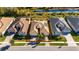 Aerial view of a single-Gathering home with a backyard and neighborhood at 15314 Valencia Del Sol St, Wimauma, FL 33598