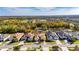 Aerial view showcasing a house's location in a residential community at 15314 Valencia Del Sol St, Wimauma, FL 33598