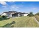 Large backyard with screened pool and patio area at 15314 Valencia Del Sol St, Wimauma, FL 33598