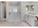 Elegant bathroom with double vanity, walk-in shower, and separate toilet at 15314 Valencia Del Sol St, Wimauma, FL 33598