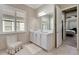 Bright bathroom with white vanity, and view of bedroom at 15314 Valencia Del Sol St, Wimauma, FL 33598
