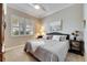 Spacious bedroom with king-size bed and large window at 15314 Valencia Del Sol St, Wimauma, FL 33598
