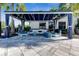 An inviting cabana area with comfortable seating and shade for relaxing outdoors at 15314 Valencia Del Sol St, Wimauma, FL 33598