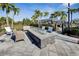 Community fire pit with seating for residents at 15314 Valencia Del Sol St, Wimauma, FL 33598