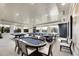 A luxurious game room with pool tables, poker tables, and comfortable seating for entertainment at 15314 Valencia Del Sol St, Wimauma, FL 33598