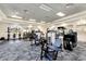 Bright gym featuring modern exercise equipment, ample space, and mirrors for a complete workout experience at 15314 Valencia Del Sol St, Wimauma, FL 33598