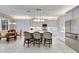Modern kitchen with white cabinets and a large island at 15314 Valencia Del Sol St, Wimauma, FL 33598
