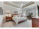 Main bedroom with king bed and built-in desk at 15314 Valencia Del Sol St, Wimauma, FL 33598
