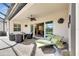 Outdoor patio with seating and access to the pool at 15314 Valencia Del Sol St, Wimauma, FL 33598