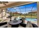 Relaxing patio with fire pit and seating area near pool at 15314 Valencia Del Sol St, Wimauma, FL 33598