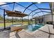 Inviting pool and spa with screened enclosure and patio at 15314 Valencia Del Sol St, Wimauma, FL 33598