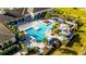 A luxurious resort-style pool area featuring multiple pools, cabanas, and plenty of seating for relaxation at 15314 Valencia Del Sol St, Wimauma, FL 33598