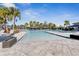 Resort-style pool with multiple seating areas at 15314 Valencia Del Sol St, Wimauma, FL 33598