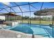 Refreshing pool and spa with screened enclosure at 15314 Valencia Del Sol St, Wimauma, FL 33598