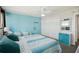 Bedroom with two beds, light blue walls and ocean view at 17920 Gulf Blvd # 1205, Redington Shores, FL 33708