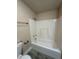 Clean bathroom featuring a bathtub and updated flooring at 1902 W Cluster Ave, Tampa, FL 33604