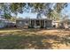Large backyard with grassy area and home view at 2085 Georgianna St, Largo, FL 33774