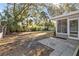 Backyard with patio, screened porch and lush landscaping at 2085 Georgianna St, Largo, FL 33774