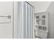 Clean bathroom with shower, toilet, and a white cabinet at 2085 Georgianna St, Largo, FL 33774