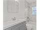 Updated bathroom with gray vanity and marble tile at 2085 Georgianna St, Largo, FL 33774