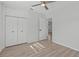 Bright bedroom featuring wood-look floors and double doors at 2085 Georgianna St, Largo, FL 33774