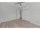 Spacious bedroom featuring wood-look flooring and a ceiling fan at 2085 Georgianna St, Largo, FL 33774