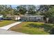 Cute house with well-maintained lawn and driveway at 2085 Georgianna St, Largo, FL 33774