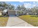 Newly renovated house with a landscaped front yard at 2085 Georgianna St, Largo, FL 33774
