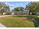 House with freshly landscaped front yard and driveway at 2085 Georgianna St, Largo, FL 33774