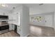 Modern kitchen with stainless steel appliances and white shaker cabinets at 2085 Georgianna St, Largo, FL 33774