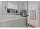 Functional laundry room with washer, dryer, and access to kitchen at 2085 Georgianna St, Largo, FL 33774
