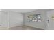 Bright living room with large window and wood-look floors at 2085 Georgianna St, Largo, FL 33774