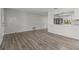 Open concept living room, kitchen, and wood floors at 2085 Georgianna St, Largo, FL 33774