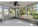 Sunroom with a ceiling fan and view of the backyard at 2085 Georgianna St, Largo, FL 33774