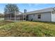 Large backyard with grassy area and pool at 22921 Sterling Manor Loop, Lutz, FL 33549