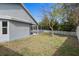 Landscaped backyard with grassy area and pool at 22921 Sterling Manor Loop, Lutz, FL 33549