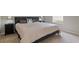 Spacious bedroom with large bed, nightstands, and window at 22921 Sterling Manor Loop, Lutz, FL 33549