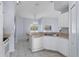 Kitchen with white cabinets, granite countertops and island at 22921 Sterling Manor Loop, Lutz, FL 33549
