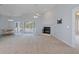 Spacious living room with fireplace and view of the pool at 22921 Sterling Manor Loop, Lutz, FL 33549
